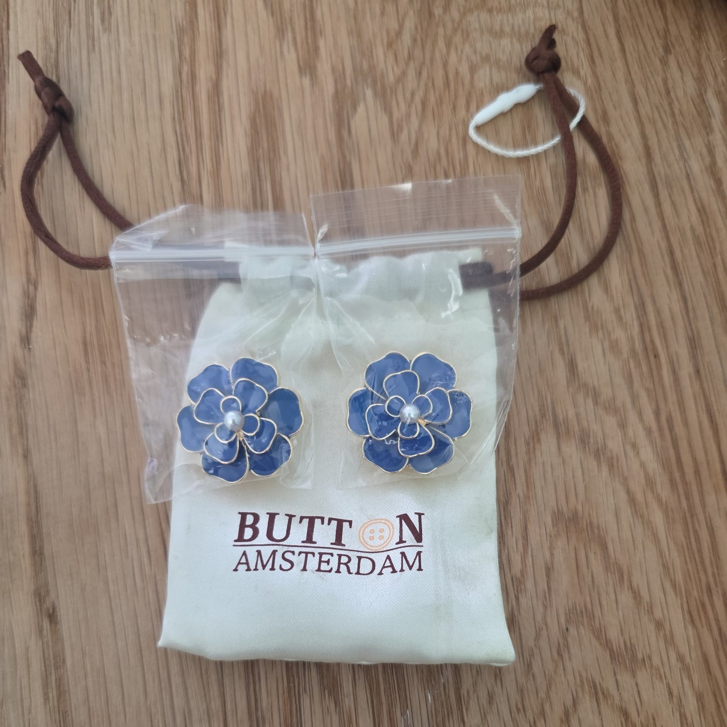A Set of Two Button Amsterdam Button Covers In Original Packaging Unused