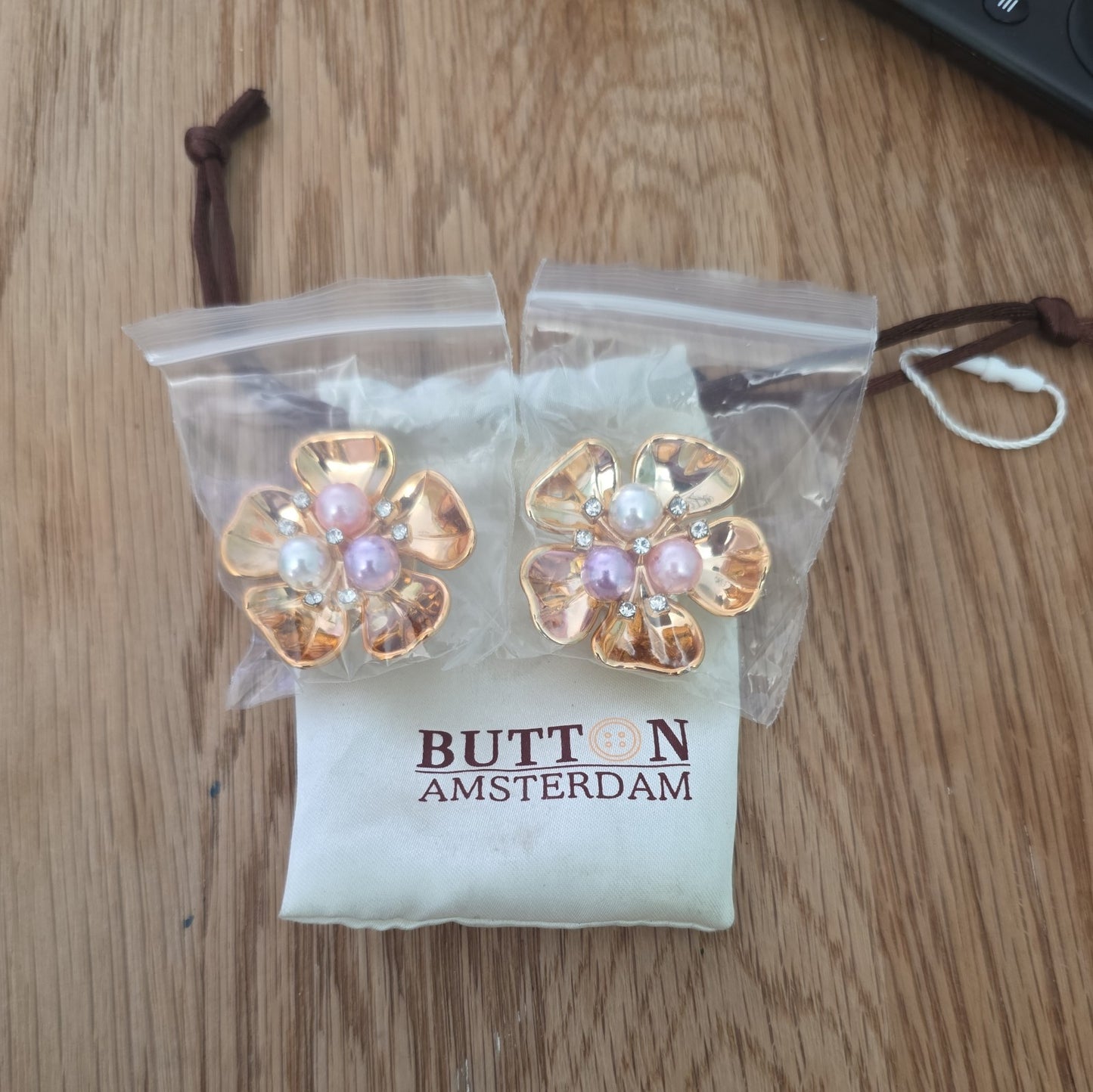 A Set of Two Button Amsterdam Button Covers In Original Packaging Unused